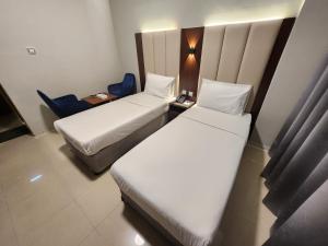 Postel nebo postele na pokoji v ubytování Melody Queen Hotel by AURA