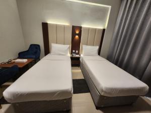 Postel nebo postele na pokoji v ubytování Melody Queen Hotel by AURA
