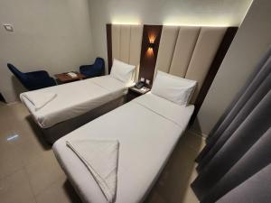 Postel nebo postele na pokoji v ubytování Melody Queen Hotel by AURA