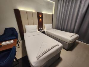 Postel nebo postele na pokoji v ubytování Melody Queen Hotel by AURA