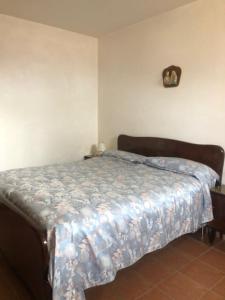 a bedroom with a bed with a blanket on it at Campo Felice Casa del Lupo in Collimento +19 photos