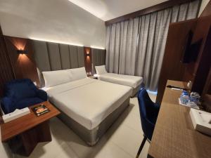 Postel nebo postele na pokoji v ubytování Melody Queen Hotel by AURA