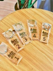 a group of four wooden numbers on a table at Lamai Home 3 in Ko Yao Noi