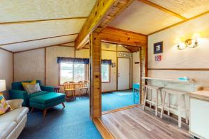a living room with a couch and a table at Catfish Cottage B in Eagle River