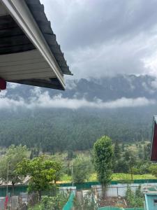 a view of a mountain from a house at Pearl Residency in Pahalgām +37 photos
