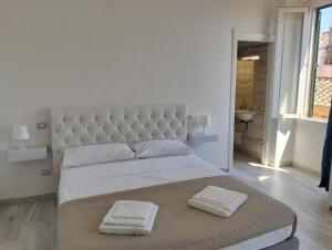 Postel nebo postele na pokoji v ubytování Suite Palazzo Siotto