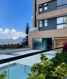 een afbeelding van een gebouw met een zwembad bij Parma 2305 - Elegance in the Urban Heart / Poblado in El Poblado