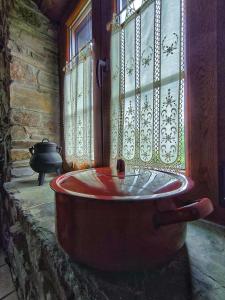 a bath tub in a room with a window at 39A01 La Casita Olga Casa en plena naturaleza in Arrojo