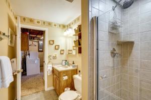 a bathroom with a shower and a toilet and a sink at Lakefront and Dog-Friendly Gem in Gravois Mills in Gravois Mills +34 photos