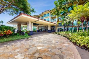 a walkway in front of a building at Waipouli Beach Resort H105 in Kapaa