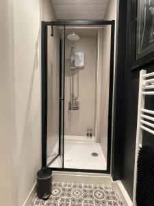 a shower with a glass door in a bathroom at Foundry Street Apartment 1 - Dunfermline City Centre in Dunfermline
