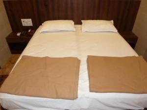 Postel nebo postele na pokoji v ubytování Hotel Regal Palace