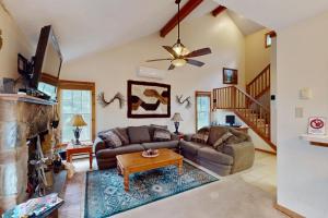 a living room with a couch and a fireplace at Northridge 472 in Tannersville