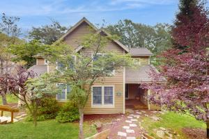 a yellow house with a pathway leading to the front door at Northridge 472 in Tannersville