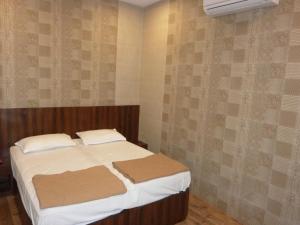 Postel nebo postele na pokoji v ubytování Hotel Regal Palace