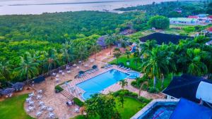 an aerial view of a resort with a swimming pool at Tanga Beach Resort & Spa in Tanga