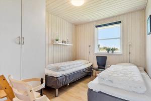 Ένα ή περισσότερα κρεβάτια σε δωμάτιο στο 3397-Hvide-Sande-Anker-Eskildsens-Vej-12