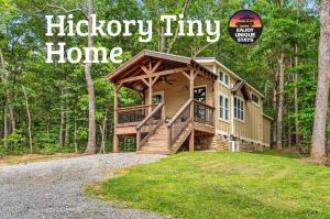 a magazine cover of a tiny house in the woods at Hot Tub, Secluded Hickory Tiny Home in Menlo! in Menlo