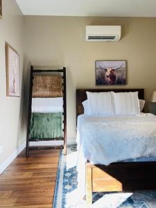 a bedroom with a large bed and a window at Apple Valley Gables-Cozy mountain home with views in Hendersonville