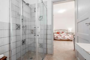 a bathroom with a shower with a glass door at Agriturismo Giusti in Magliano in Toscana +72 photos