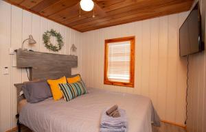 a bedroom with a large bed in a room at 4 Beachfront Cottages - New Bathrooms and Roofs in Lincoln Junction +42 photos