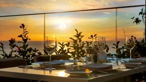 a table with wine glasses and a view of the ocean at Crowne Plaza Florya Istanbul by IHG in Istanbul