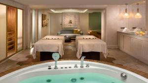 a room with a bath tub and a living room at Crowne Plaza Florya Istanbul by IHG in Istanbul