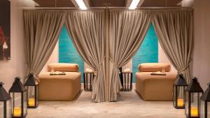 a room with two beds and two windows at Crowne Plaza Florya Istanbul by IHG in Istanbul