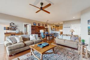 a living room with a couch and a table at Reserve Your Happy Place in Sugar Mountain