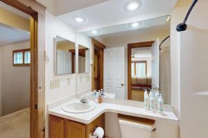 a bathroom with a sink and a mirror at Northridge 472 in Tannersville +18 photos