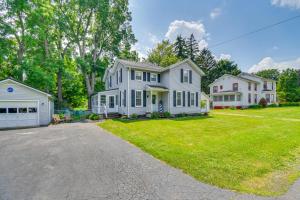 a large white house with a driveway at Sodus Point Home - Walkable to Beach! in Sodus