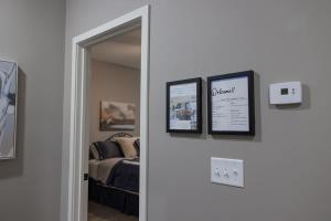 a door leading to a bedroom with a bed at Spacious 3 bed 2 bath with King Master in Sycamore in Sycamore