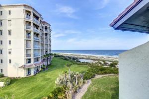 an apartment building with a view of the ocean at Hotel Side Condo at Amelia Island Plantation with Balcony, WiFi & Shared Pool in Fernandina Beach