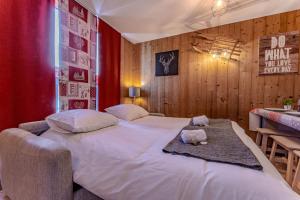 Ένα ή περισσότερα κρεβάτια σε δωμάτιο στο 1BR Val Thorens Slopeside Heart of Resort