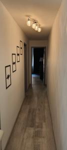 a hallway with pictures on the walls of a room at Le cinéma dans le Verdon classé 3 étoiles in Riez