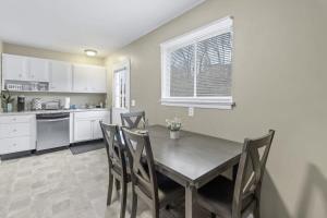 a kitchen with a dining room table and chairs at Hillside Haven - affordable and convenient in Chattanooga