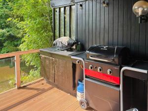 a grill sitting on a deck with a grill at Cozy Family Holiday Home By Nordstrand in Nykøbing Sjælland