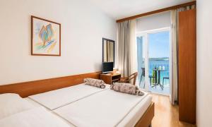 Postel nebo postele na pokoji v ubytování Orsan Maradiso Hotel by Aminess