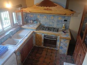 Kuchyň nebo kuchyňský kout v ubytování Villa Gemma