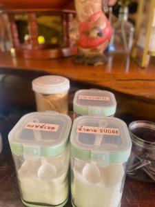 two plastic containers of food sitting on a counter at บ้านสวนภูรจิตร Baansuanphurajit in Ban Nong Pa Kha