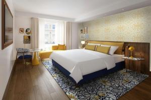 Ένα ή περισσότερα κρεβάτια σε δωμάτιο στο Park Grand London Kensington +14 φωτογραφίες