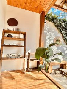 a room with a wooden shelf and a plant at Jeonju Sosohanhanok in Jeonju