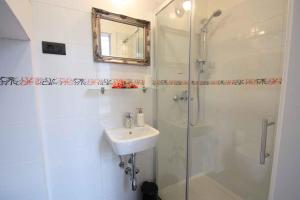 a bathroom with a shower and a sink and a mirror at Holiday home in Crikvenica 5589 in Crikvenica +27 photos