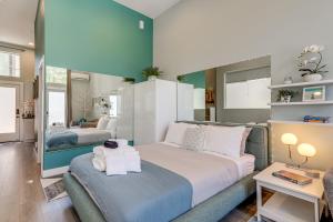 a bedroom with two beds with towels on them at Walk to Discovery Park Bright Studio in Magnolia in Seattle