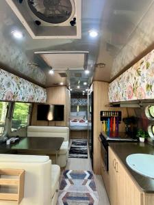 an rv kitchen with a sink and a counter at Moonbeam Airstream in Oakland +12 photos