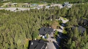 an aerial view of a house in a forest at Villa Aatu Levi Ski-in Ski-out in Levi