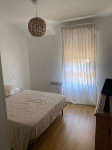 Ένα ή περισσότερα κρεβάτια σε δωμάτιο στο Chambre cosy