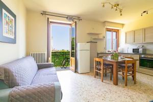 a living room with a couch and a table at Villa with Sea View Parking in Lapedona