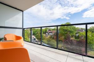 a room with a view of a house at Your Holidays Bel Mare Aqua 537F in Międzyzdroje