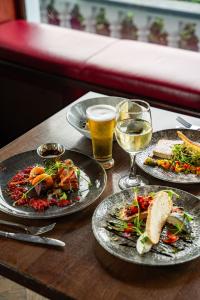 a table with three plates of food and two glasses of wine at The Rine in Newmarket on Fergus +55 photos